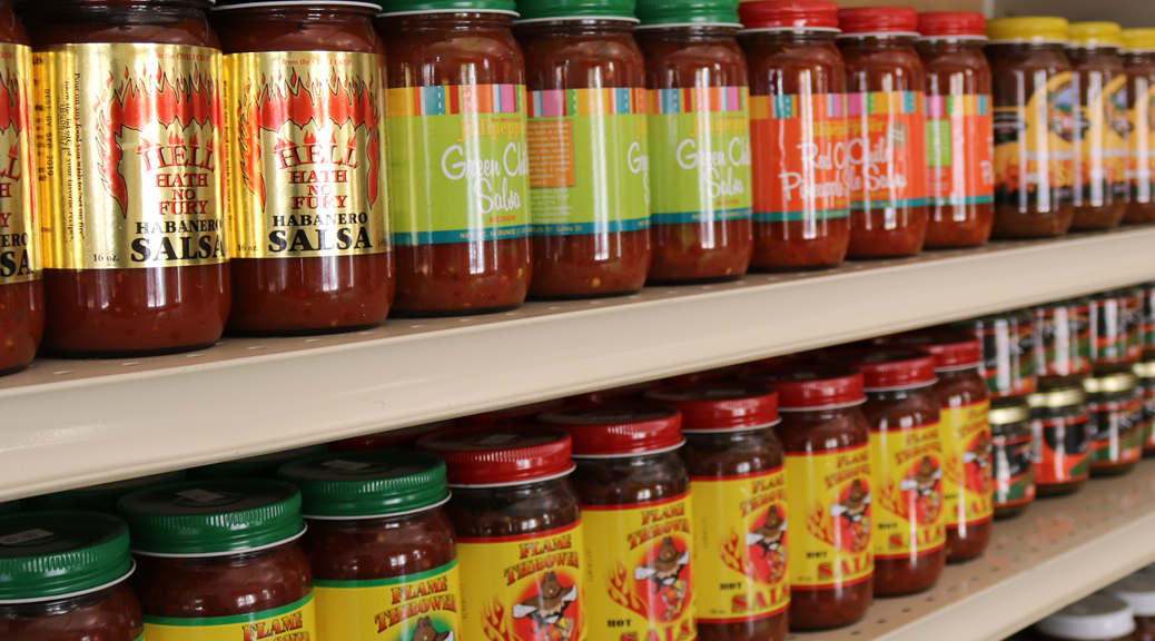 many varieties local salsa on grocery shelf